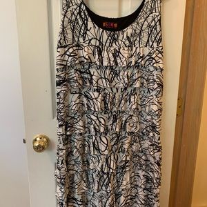 Isle white and black women’s “cha cha” dress, sleeveless.